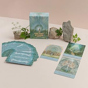 Set of ancient stones oracle cards and stones with nature-themed design on a light background