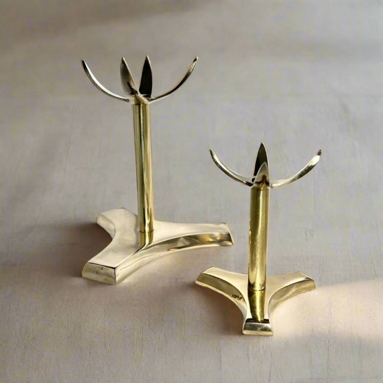 two brass tall clawed display stands for crystal spheres or minerals