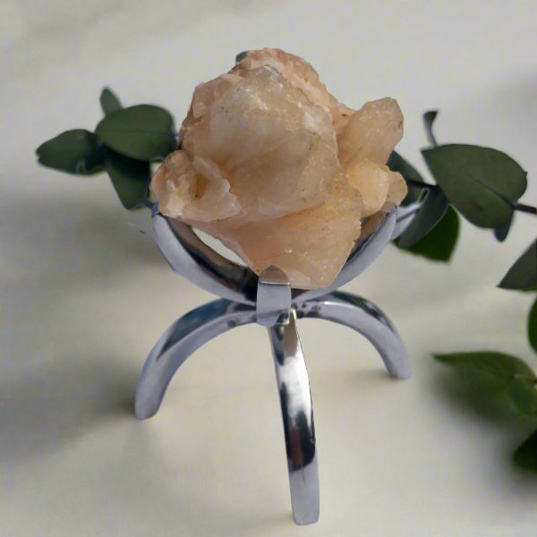 zeolite cluster on crystal display stand with eucalyptus