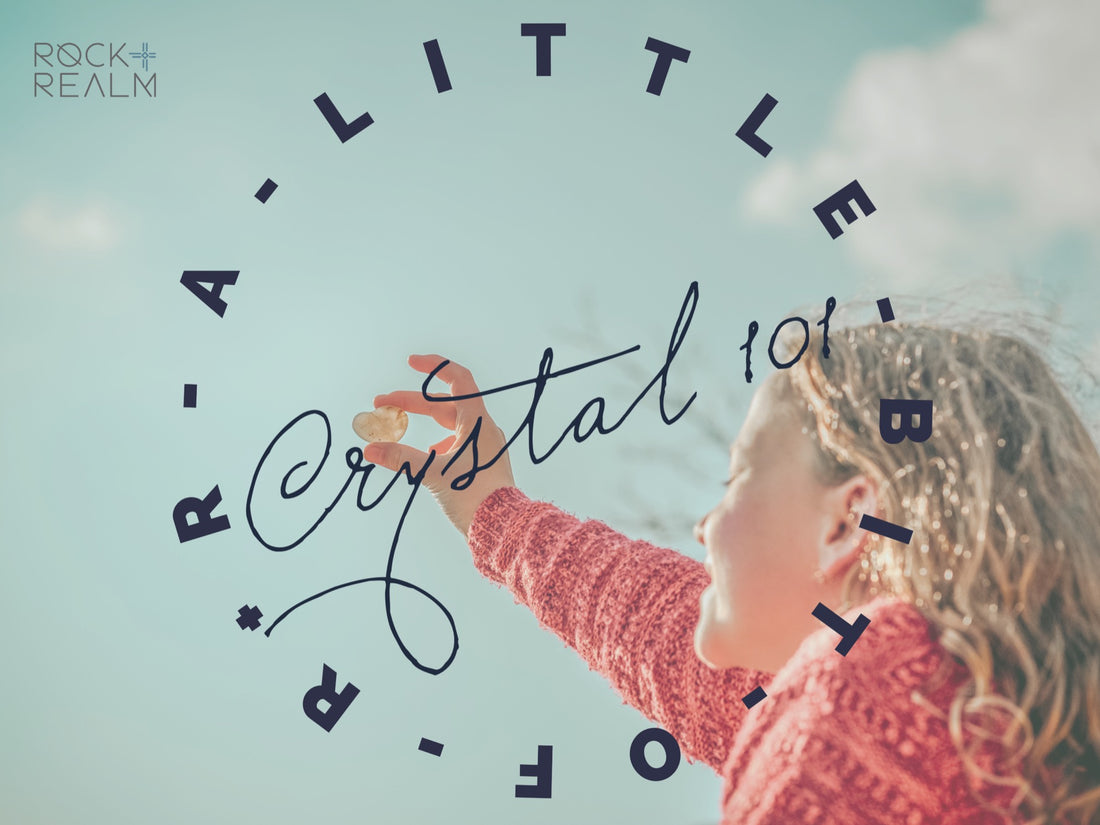 A little girl holding a crystal behind the blog logo