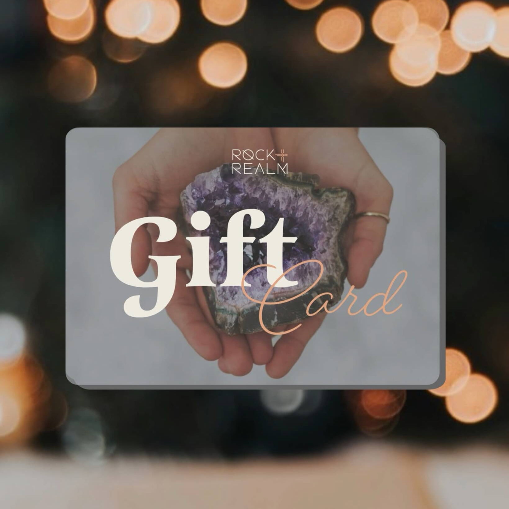 Gift card with hands holding a crystal against a blurred bokeh background