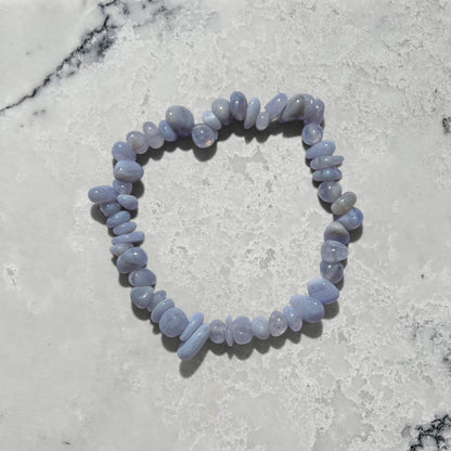 Blue Agate crystal chip gemstone bracelet on a marble surface