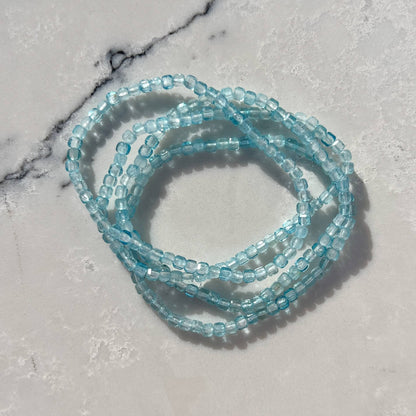 Blue Topaz gemstone beaded bracelet on a marble surface