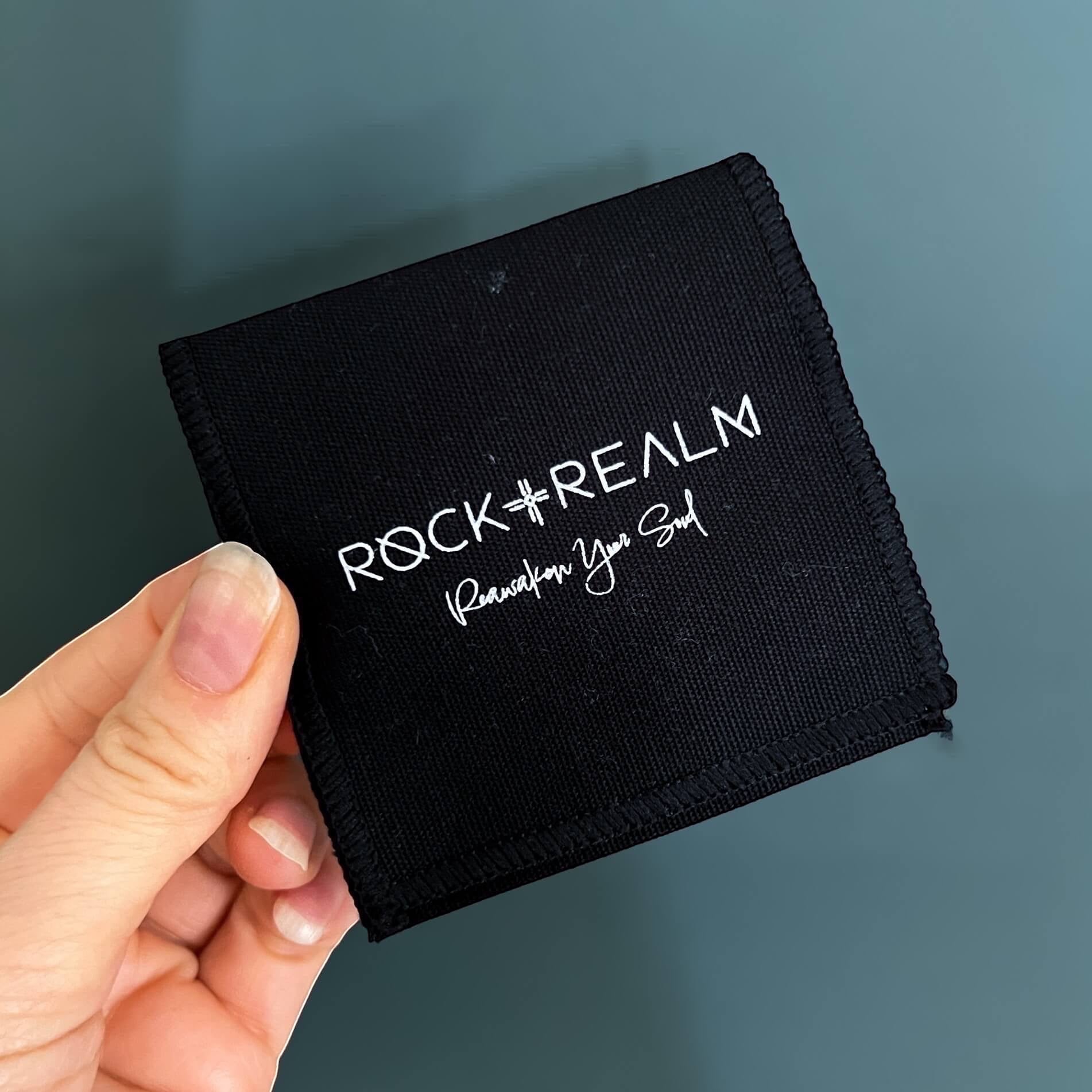 Rock + Realm Crystals black  cotton jewellery pouch with white logo and text 'Reawaken Your Soul'