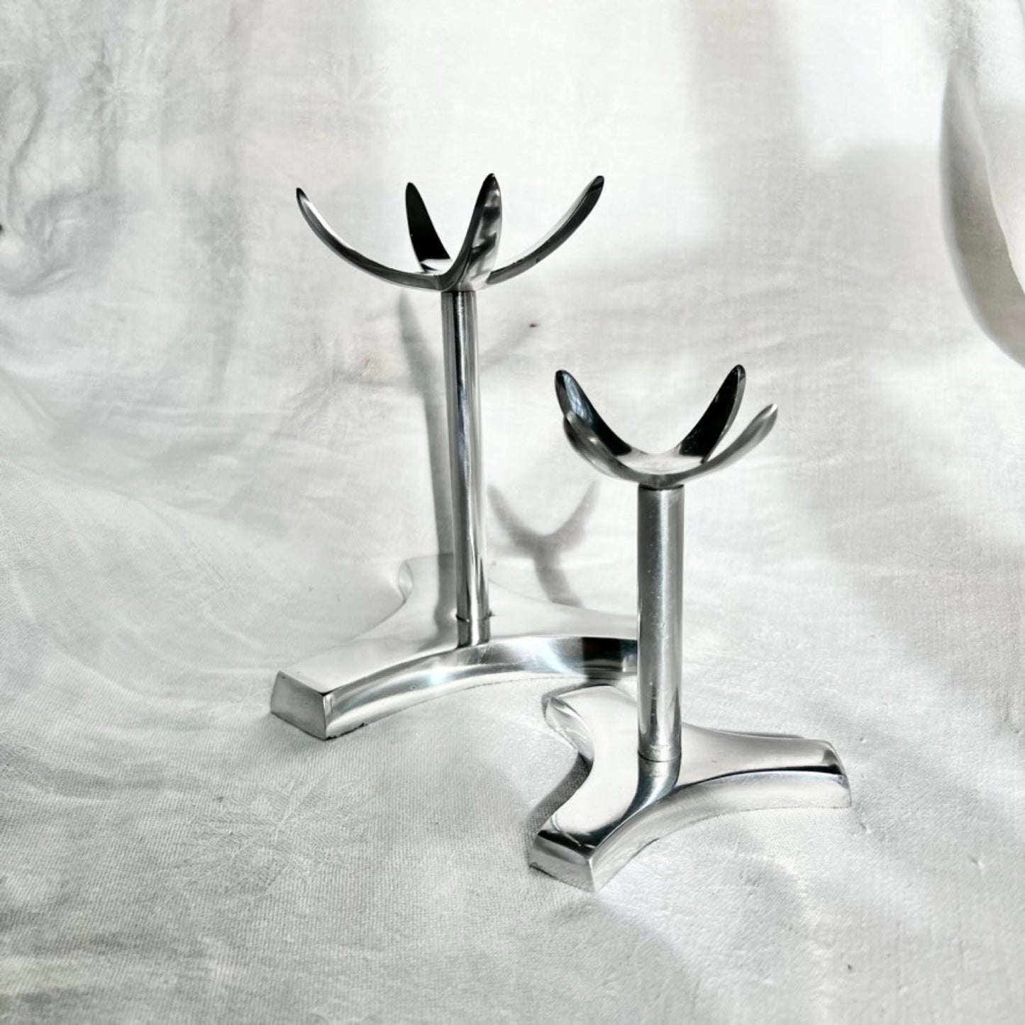 A large and small tall crystal display stand in aluminium
