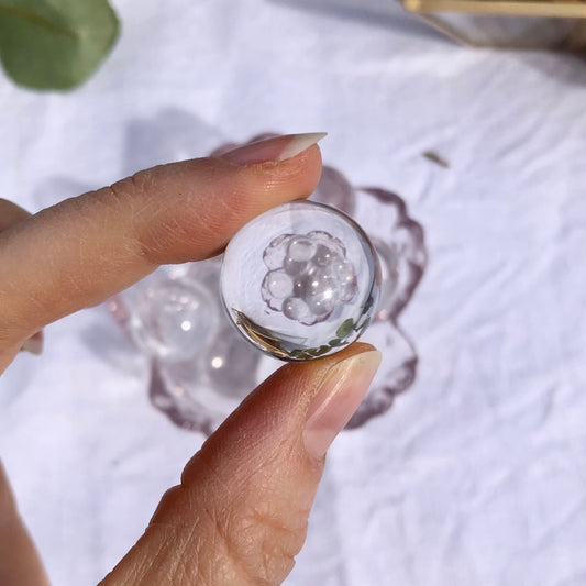 mini clear quartz crystal sphere close up