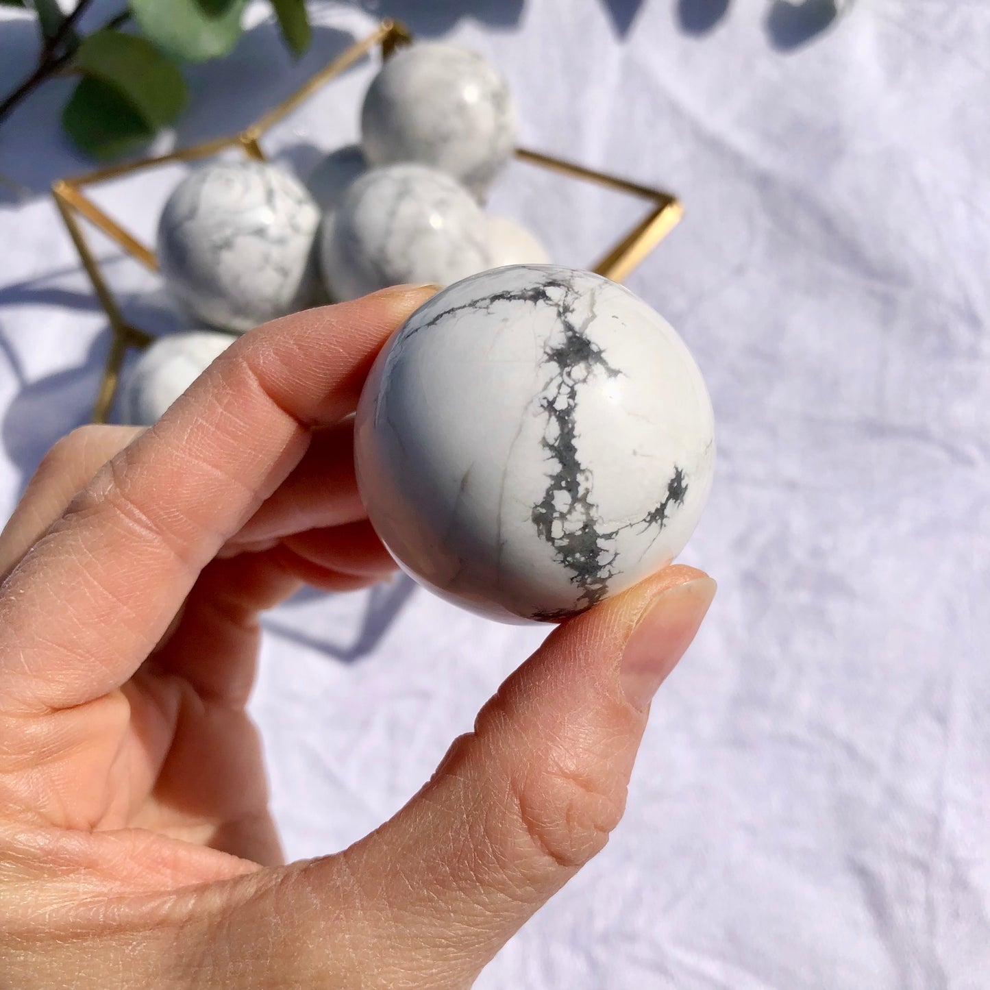 Close up of white and grey Howlite spheres