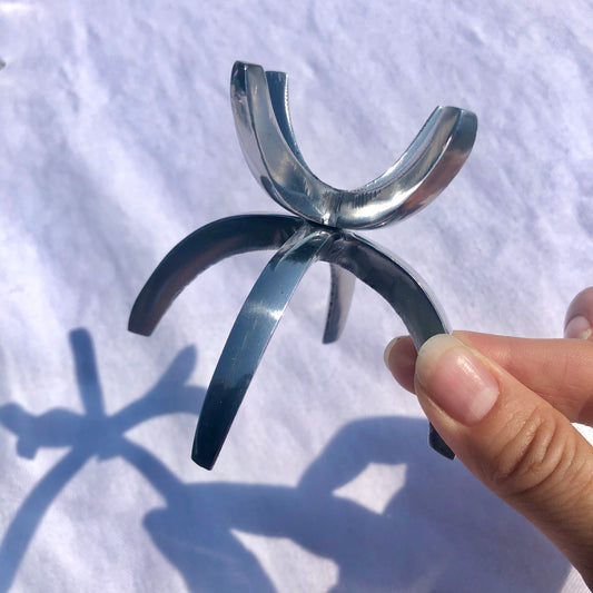 A small aluminium claw crystal sphere holder