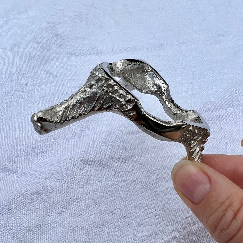 Silver nickel vintage style small crystal sphere holder held to show edge